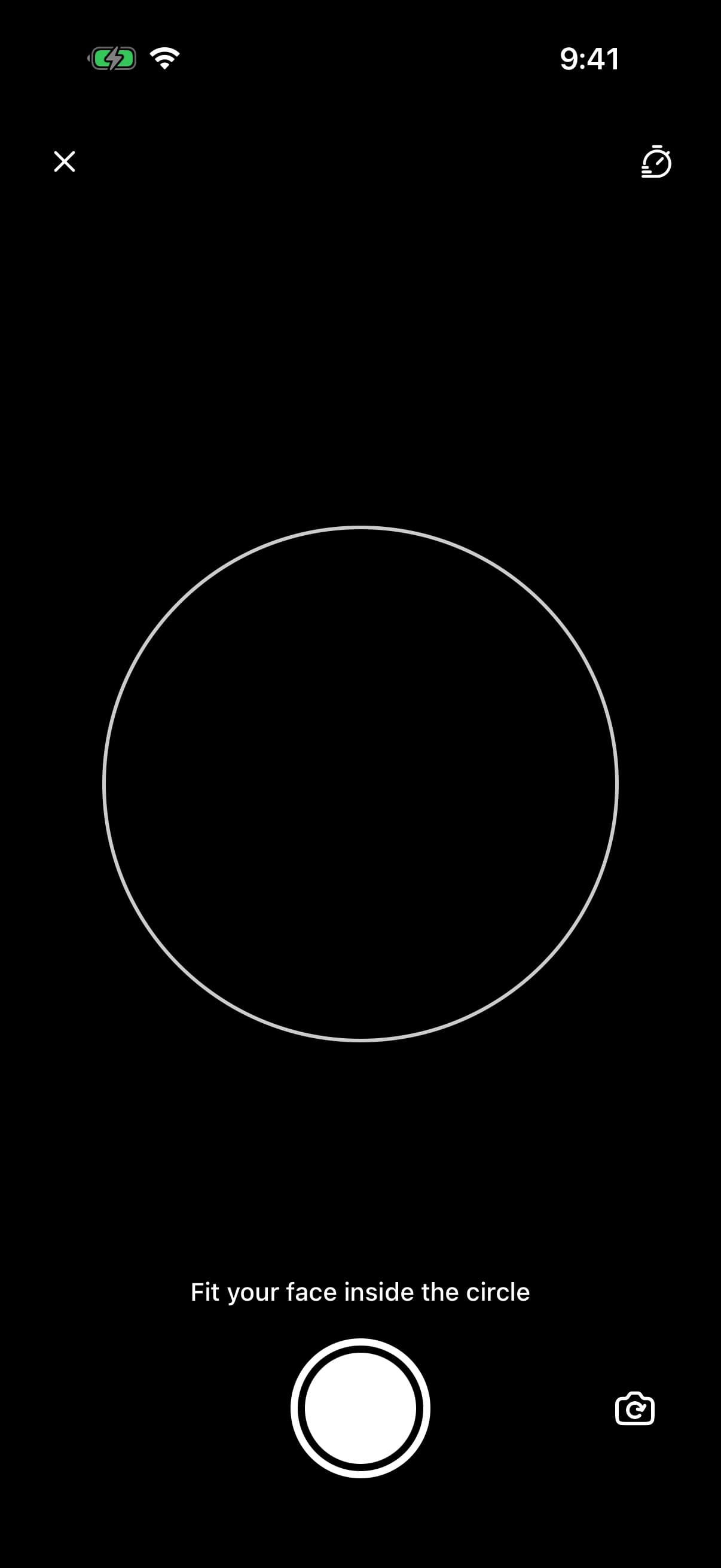 The front camera with a white circle to frame a face in, the hint Fit your face inside the circle, a white shutter and the switch-camera button.